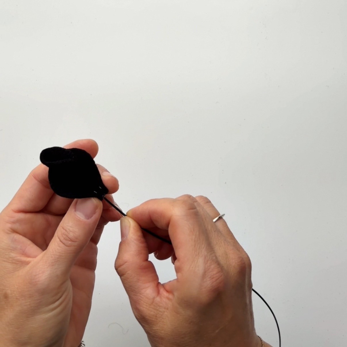 Pinch the base of the petal