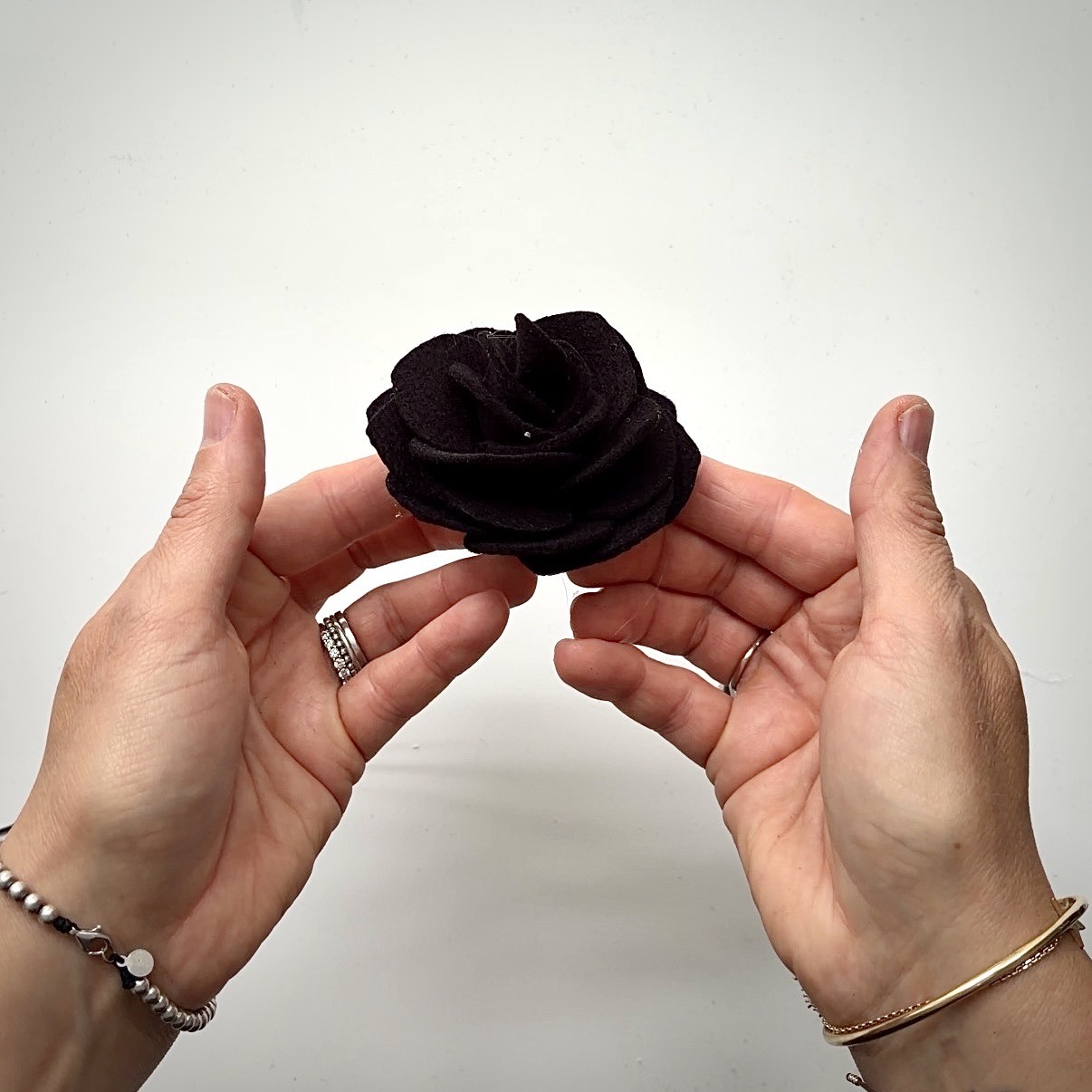 Finished black felt rose
