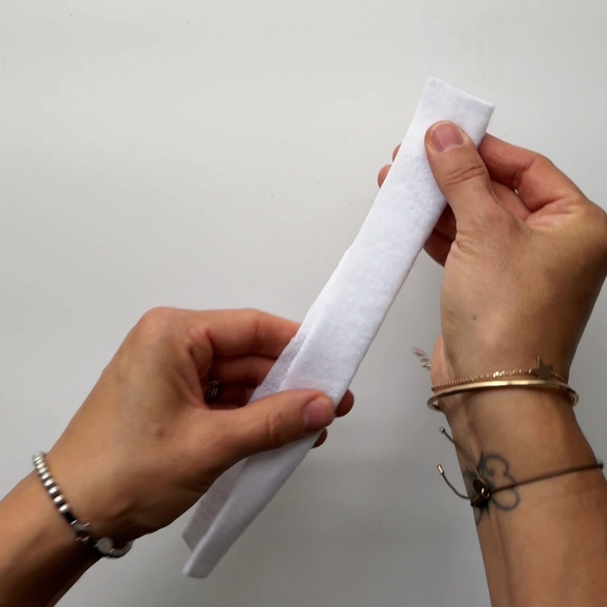 Fold a strip of white felt lengthwise