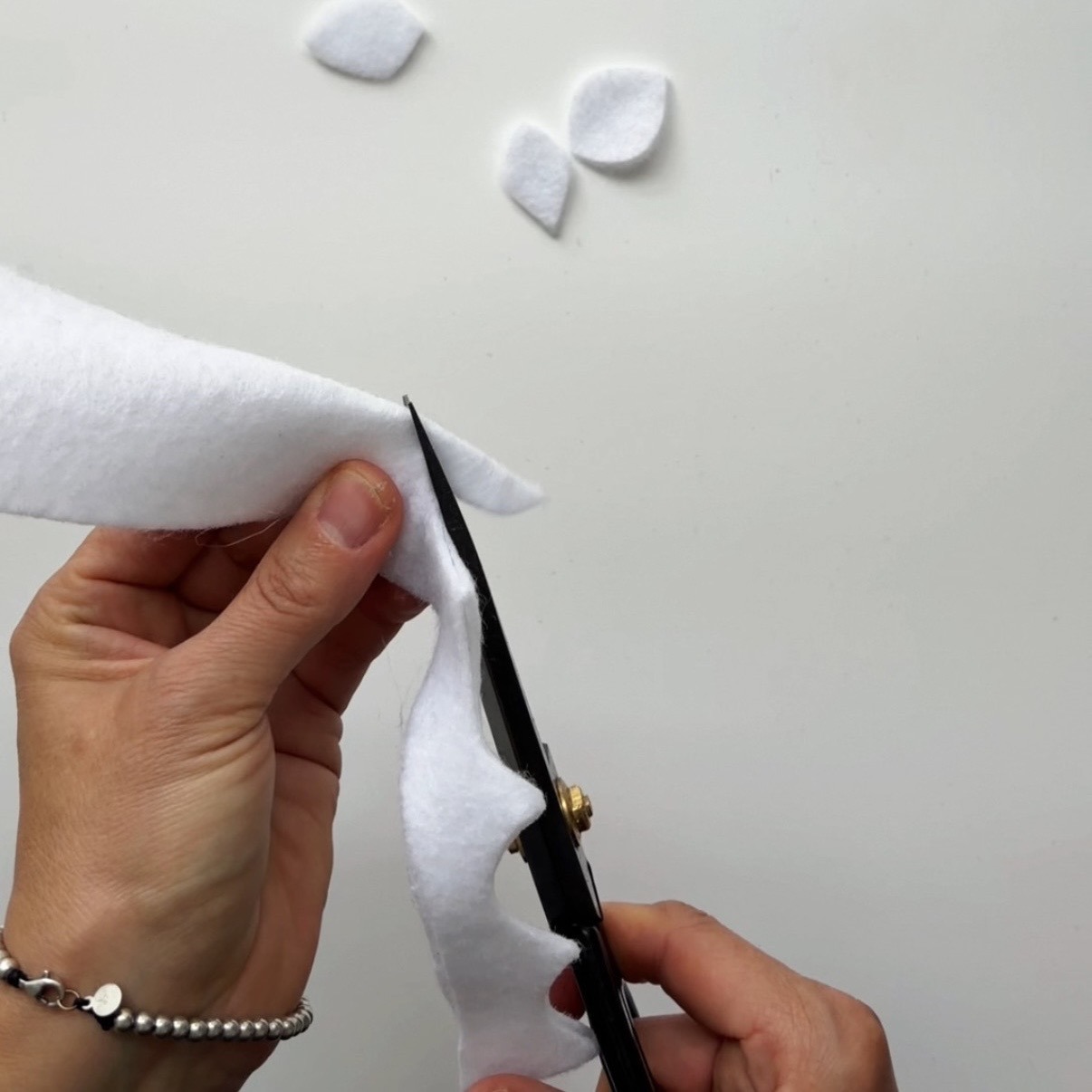 Cut leaf shapes from the white felt