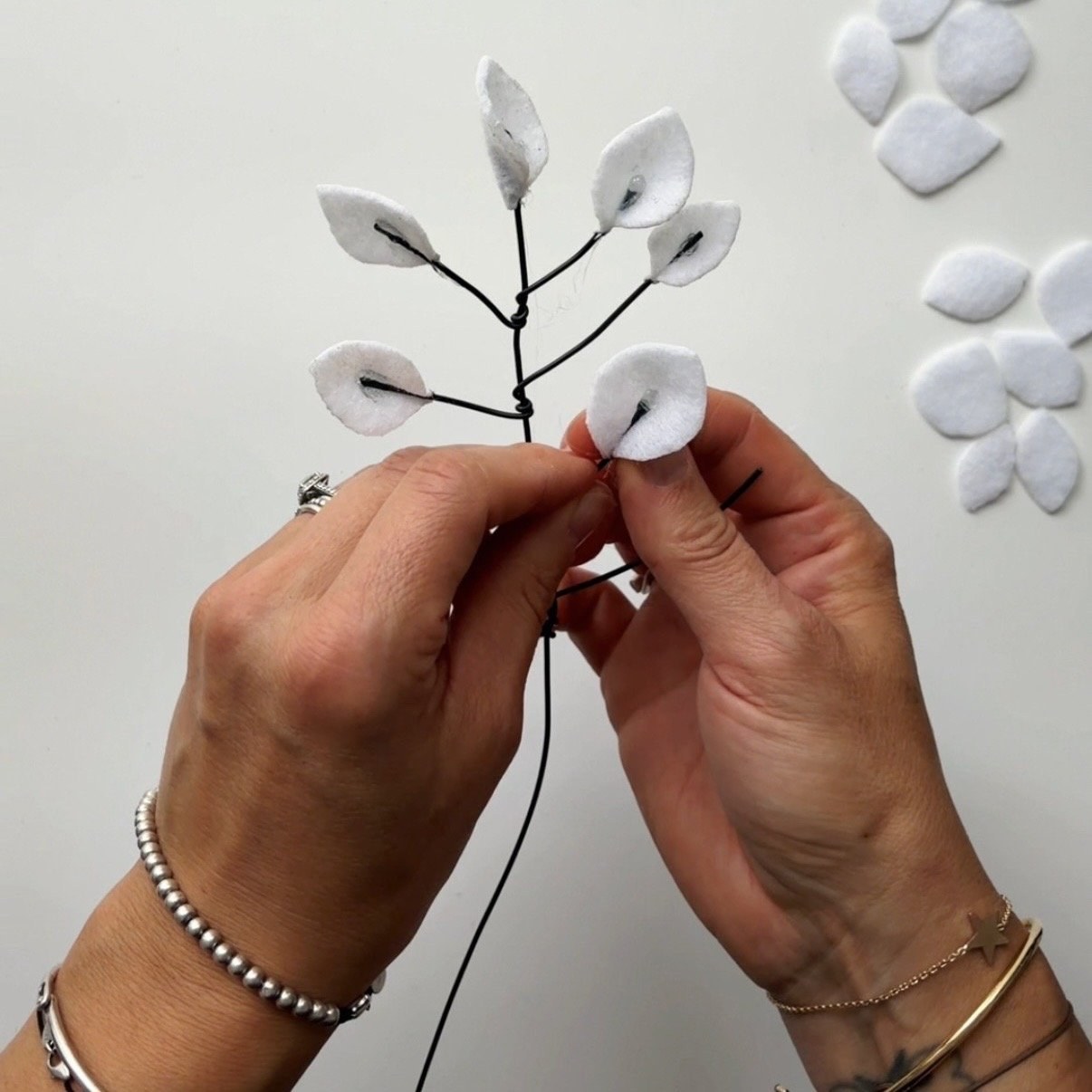 Glue white felt leaves at the end of each stem