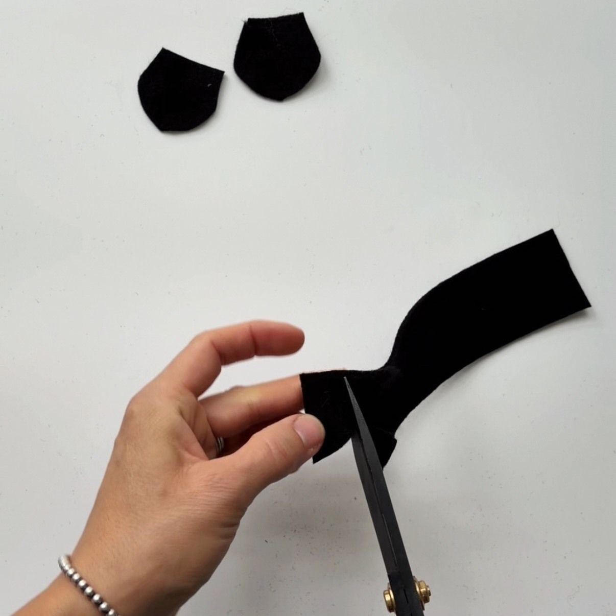 Cut a petal from a folded felt strip