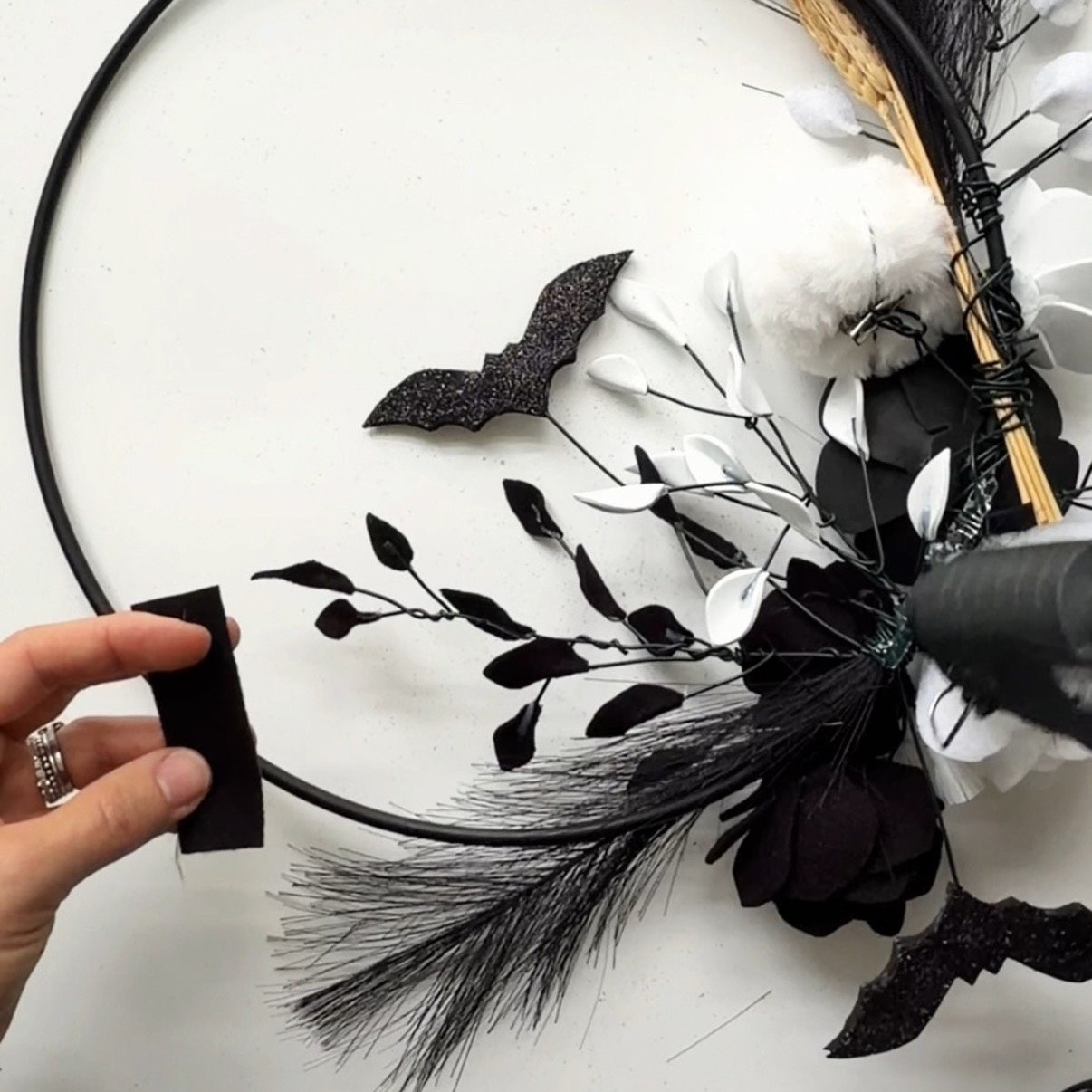 Apply hot glue on the attachments at the back of the wreath